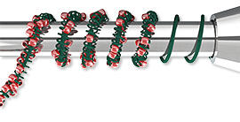 coil-wrapped wire being coiled on a rod